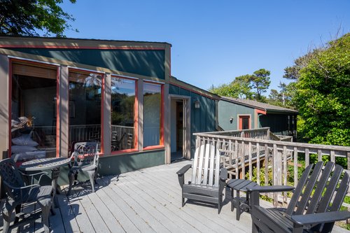 A second story deck connects the primary bedroom and the studio apartment.
