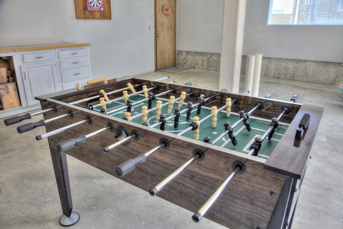 The game-room in the garage provides entertainment when winds blow and the skies darken with Foosball.