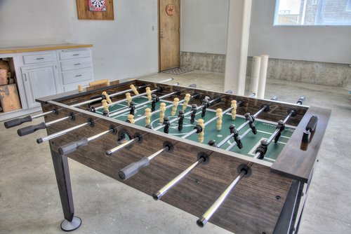 The game-room in the garage provides entertainment when winds blow and the skies darken with Foosball.