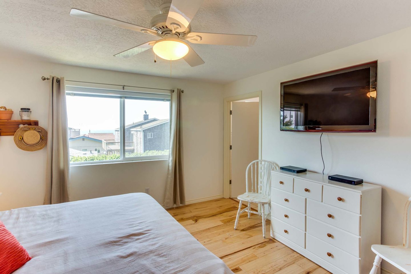 Relax and watch late night television from the king bed in the master bedroom.