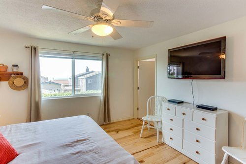 Relax and watch late night television from the king bed in the master bedroom.