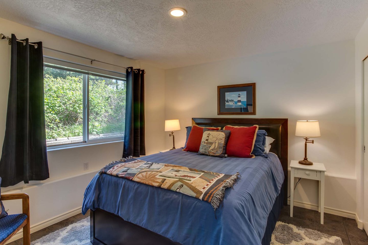 The downstairs queen bed is comfy and cozy.