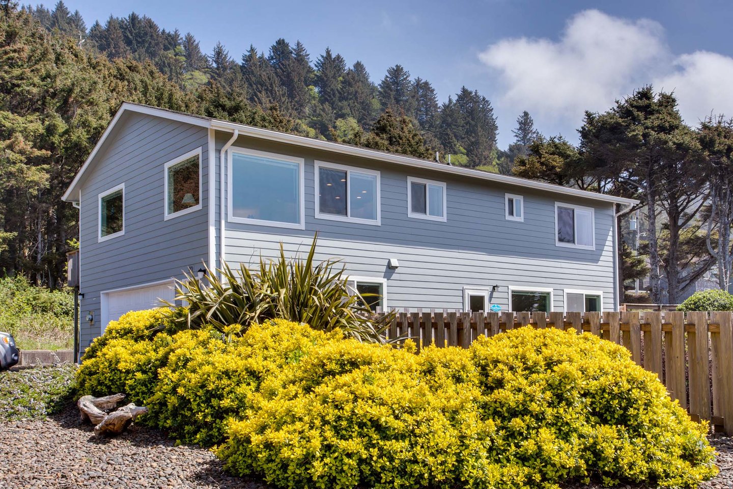 Summershore is an immaculate two story home next to the rocky shore.