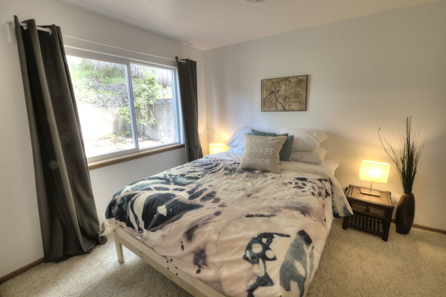 Another lovely Queen bed in a tranquil setting.