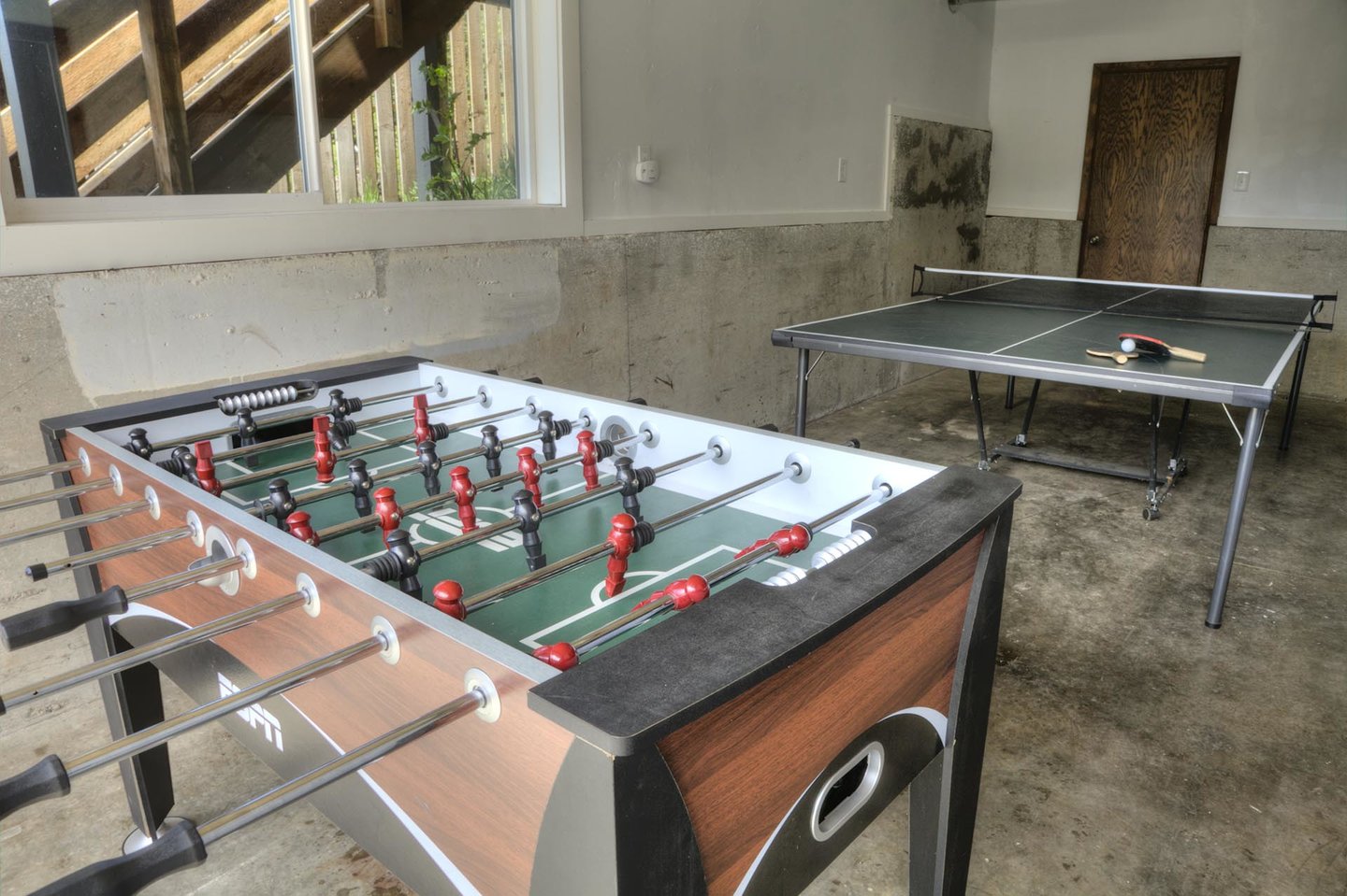 Foosball and ping-pong in the game room.