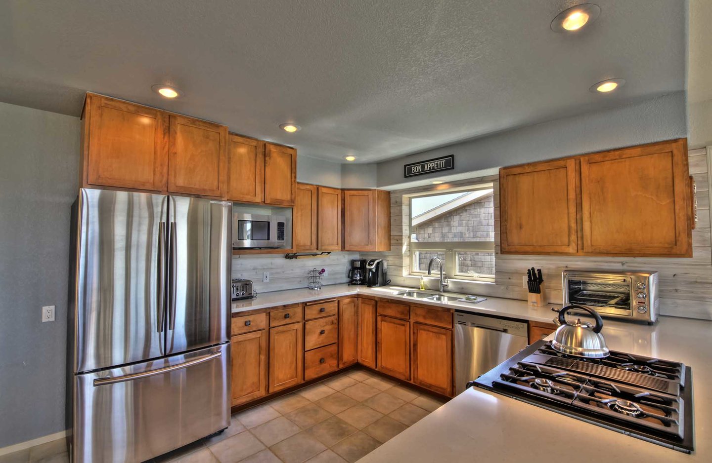 The finest in stainless steel appliances and lovely cabinetry, highlight this chef-worthy kitchen.