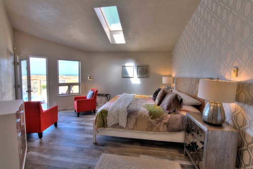 The perfect expression of high design and comfort, with seating area,  skylight, and private deck access.