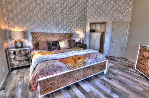 From the fantastic flooring, to the unique furnishings, this primary is a symphony of style and comfort.