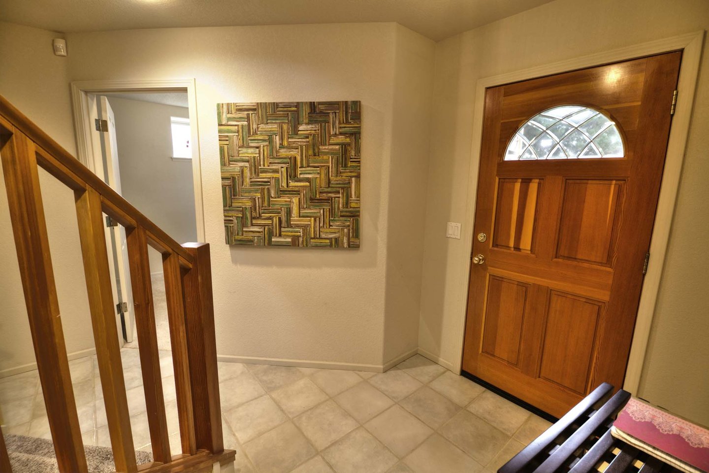 The large entryway and double railed stairway to the second floor.