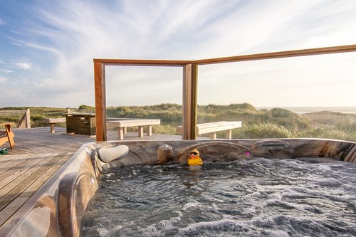 The hot tub is set in the custom deck for safety and satisfaction.