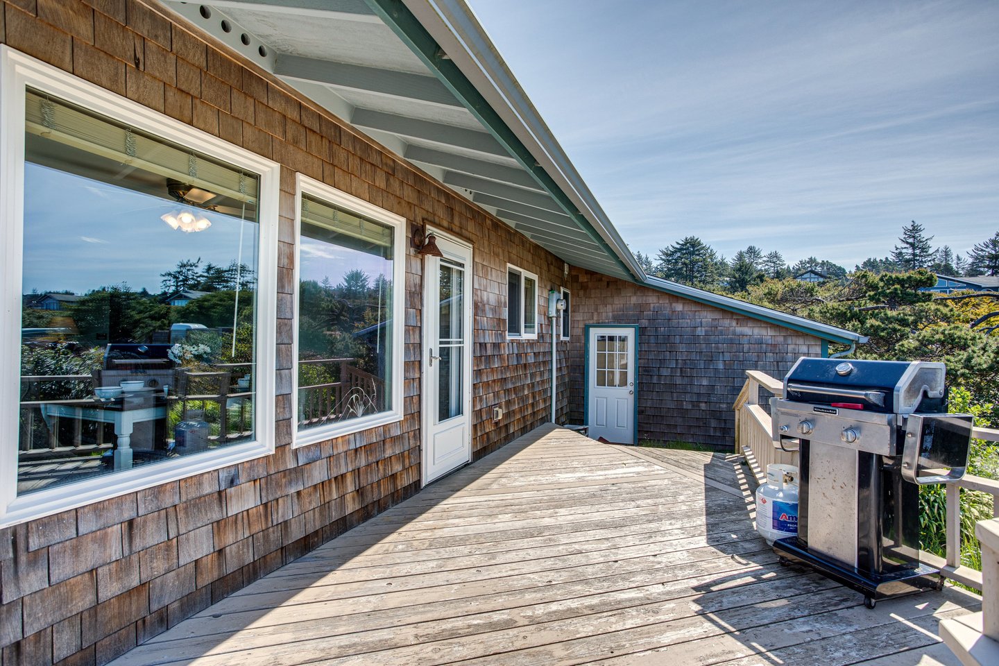 The deck off the kitchen is a perfect place to grill.
