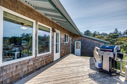 The deck off the kitchen is a perfect place to grill.