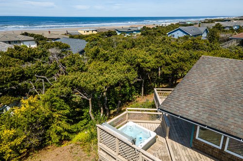 Moondance Cabin is a short walk to the sandy beach.