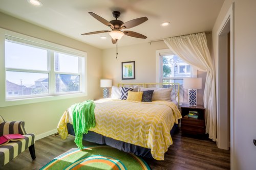 The downstairs colorful and comfortable bedroom has a King bed.