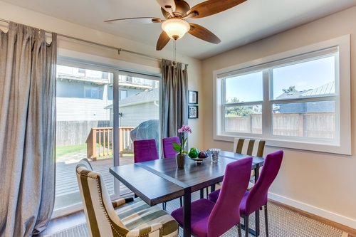 The living room area has sliding glass doors to lead out to the back deck and hot tub.