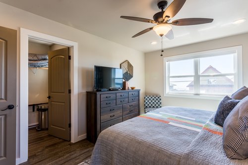 Contemporary furnishings and flat-screen HD TV in this stylish bedroom.