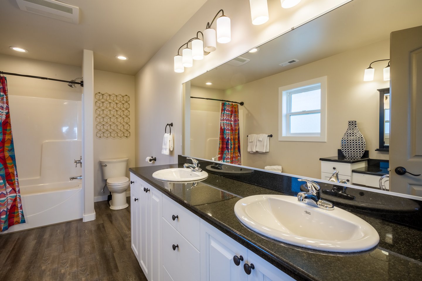 The bath features spacious double vanity sinks.