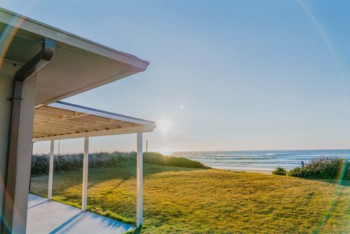 Covered back patio so you can sit outside and enjoy coastal breezes and nightly sunsets.