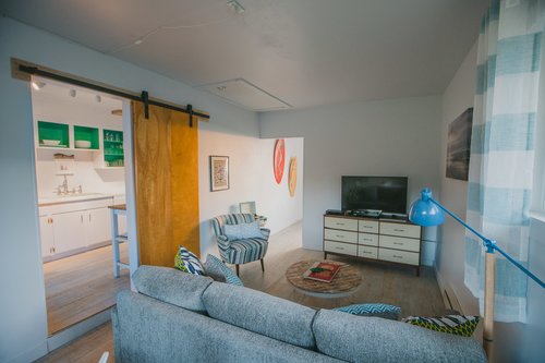 Comfortable sitting area in den adjacent to the game table.
