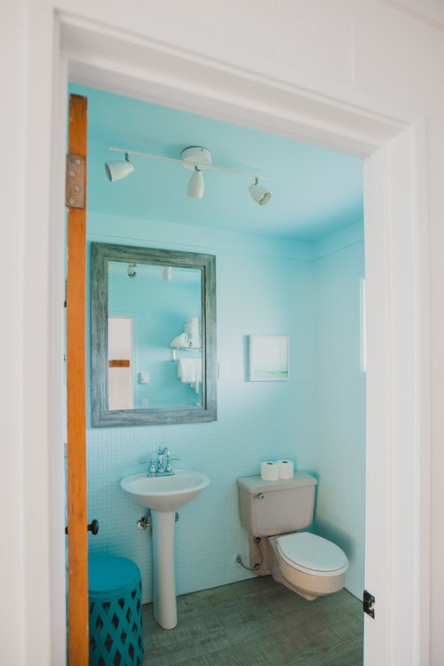 Bathroom with tub shower combo.