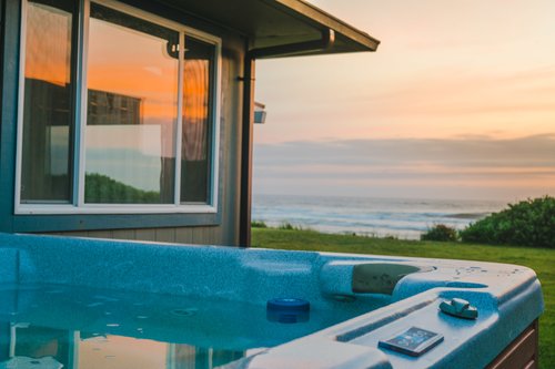 Relax in the hot tub and watch the waves as they roll in.