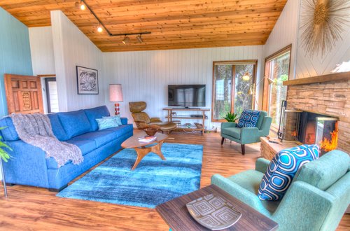 Gather in the living area with many seating options.
