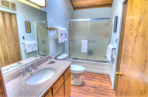 This shared bath in the hallway has plenty of room, including a washer and dryer!