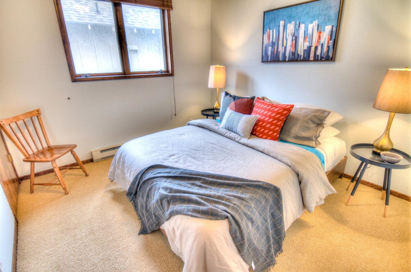 Quiet and cozy queen bed in the third bedroom.