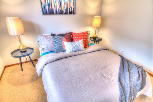 Snuggle up for some quiet time in this cozy bedroom!