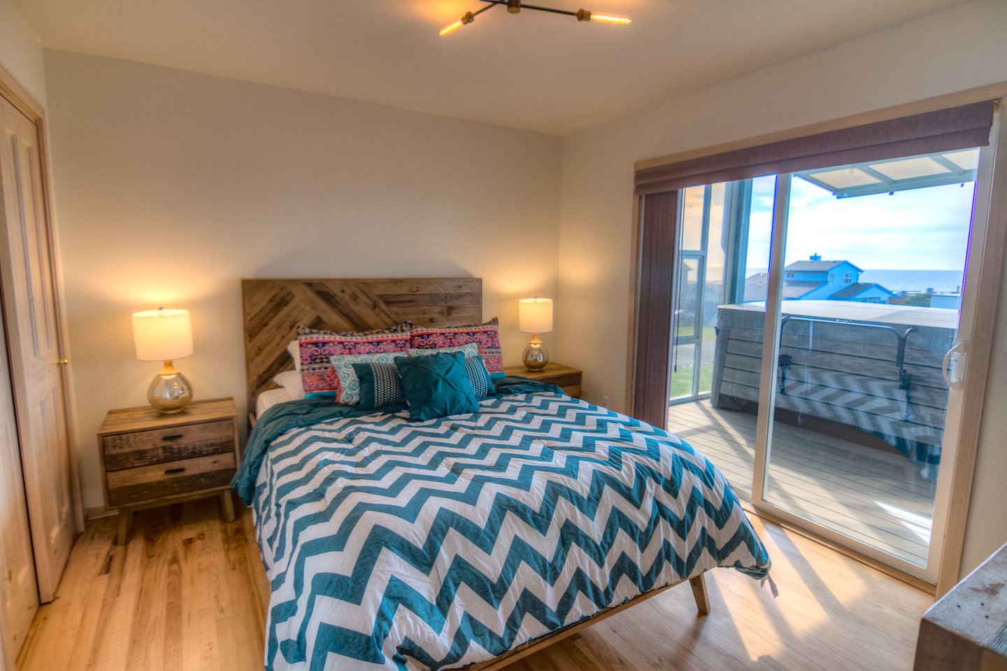 Queen bedroom with access to the deck and hot tub!