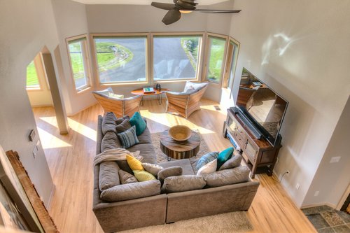 Plenty of room for everyone in this bright and airy living room.