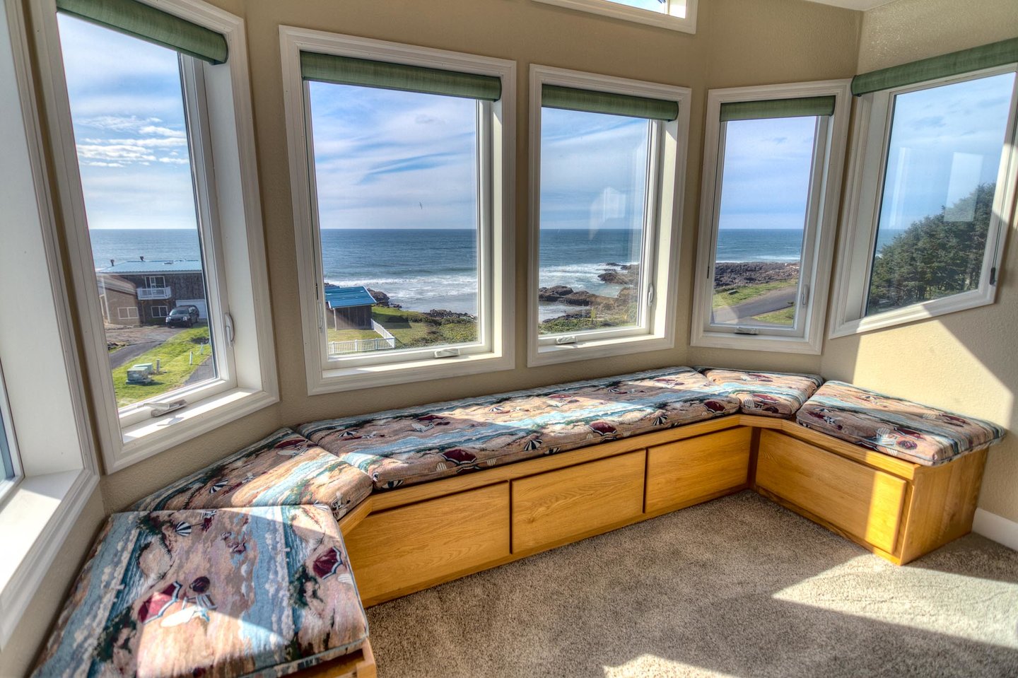 Window seating with panoramic views from the upstairs bedroom with the king bed.