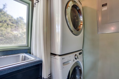 Stack washer/dryer for convenience.