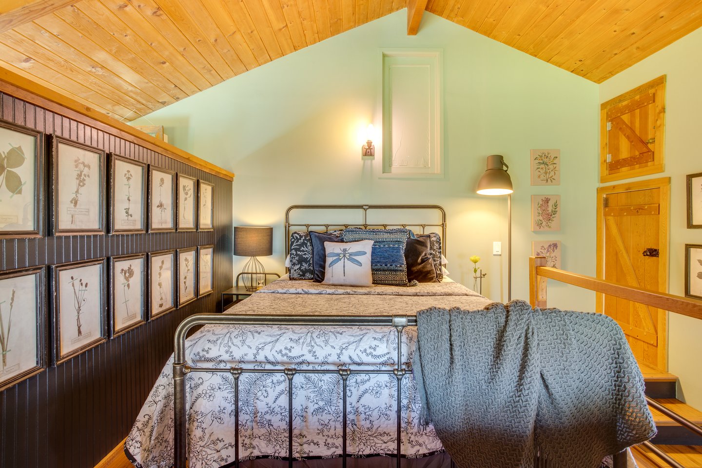 Enjoy this queen bed tucked up in a loft space