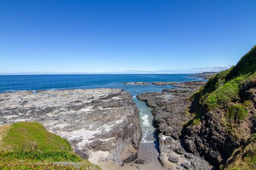 The house sits on a bluff where you can watch the tides ebb and flow through this canal.