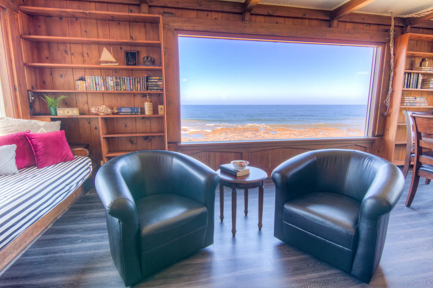 Sit and watch the changing seas and tides from this sitting area in the living room.