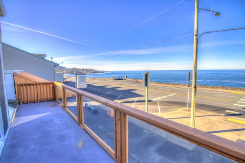 Seating out side on the balcony offers vast views of the ocean.