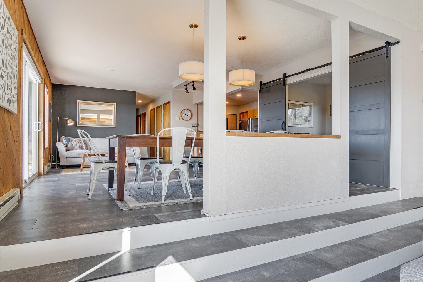 Step up from the living area to the open dining area and kitchen.