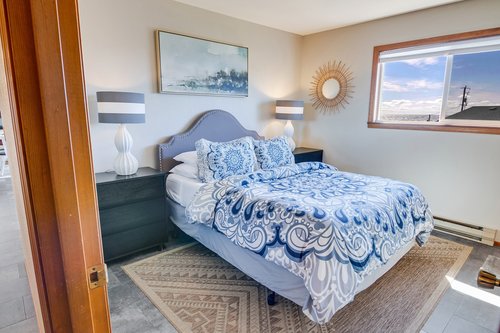 Enjoy the ocean view from this bedroom.