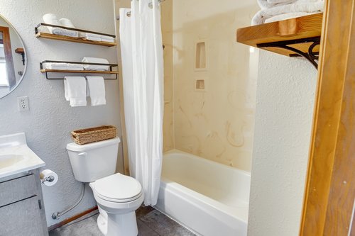 The shared bath has a tub.