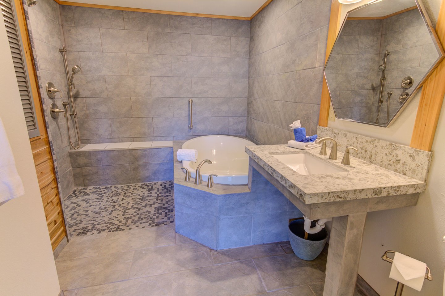 Enjoy the bath with a large soaking tub and walk in shower that has no lip or step up!