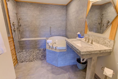Enjoy the bath with a large soaking tub and walk in shower that has no lip or step up!