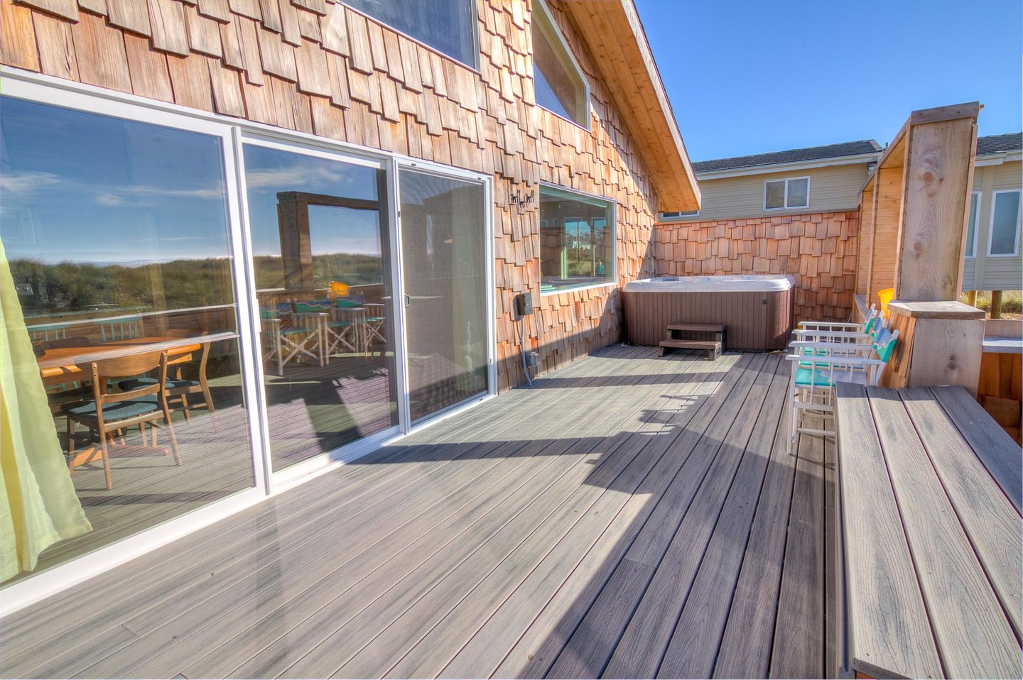 Sliding glass doors open on to this ocean view deck.