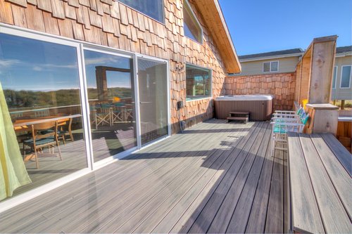 Sliding glass doors open on to this ocean view deck.