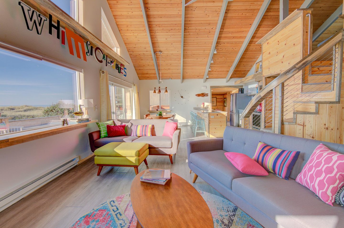 Large windows and high ceilings make this home feel spacious and bright.