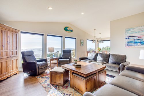 Open concept living/dining room filled with light from the large windows!