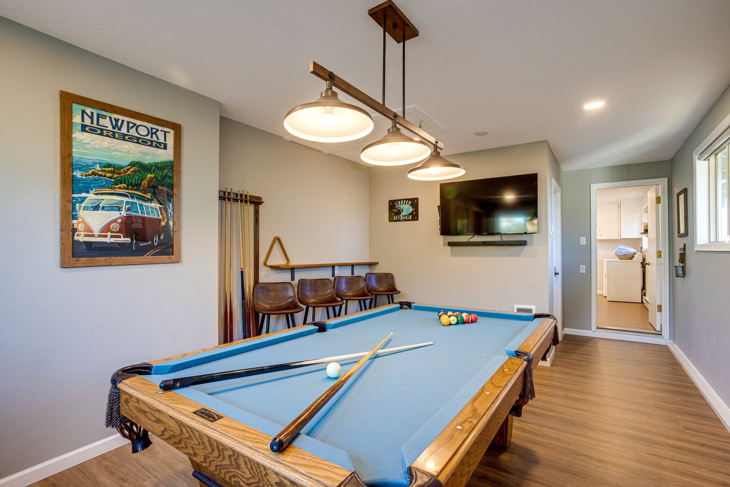Sports night with the family playing billiards and watching tv.
