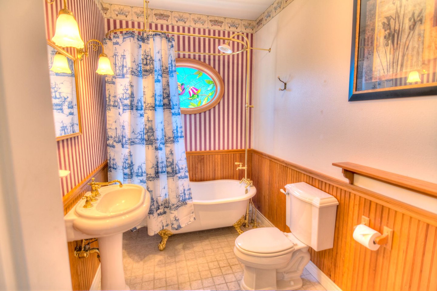 First floor bath with clawfoot tub/shower just outside of first floor bedroom
