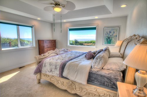 First floor bedroom with king bed and ocean views.