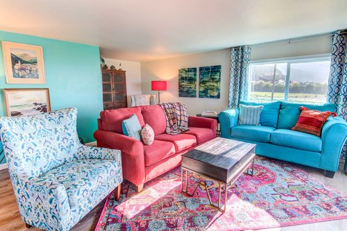 There is plenty of seating for the family to spend time together in the living room.